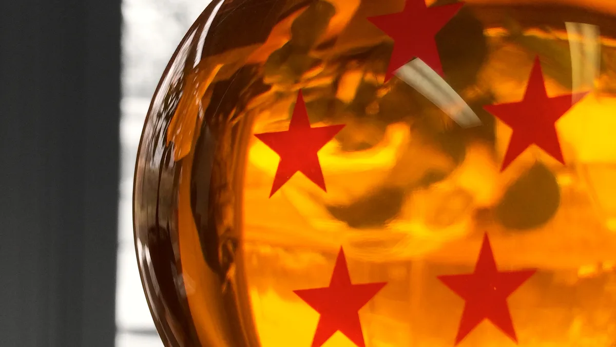 Photograph of an acrylic Dragon Ball with red stars